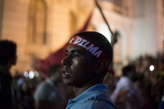 BRAZIL, Curitiba: A pro-government protester wears a headband reading Dilma during a demonstration in support of President Dilma Rousseff and former President Luiz Inacio Lula da Silva in Curitiba, Brazil, on March 18, 2016. Brazilian President Dilma Rousseff's supporters took to the streets Friday to fight back at attempts to oust her, as a flurry of court battles raged over her controversial cabinet appointment of predecessor Luiz Inacio Lula da Silva. 