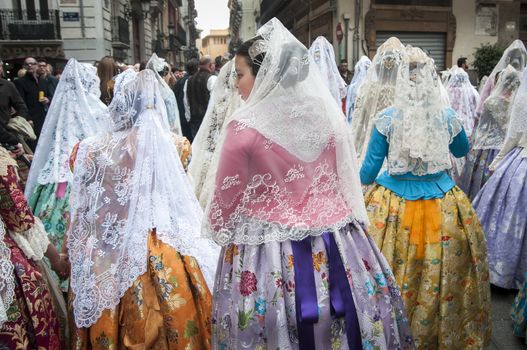 SPAIN, Valencia: Members of different fallas associations (Casales Falleros) march in the streets in Valencia, Spain, on March 18, 2016, to take part in the offering of flowers to the disadvantaged Virgin, as part of the Fallas festival. Fallas are gigantic structures made of cardboard portraying current events and personalities in which individual figures. 