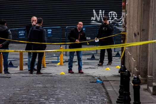 TURKEY, Istanbul: Police secure the area following a suicide bombing in a major shopping and tourist district at Istiklal street in the central part of the city on March 19, 2016 in Istanbul, Turkey. The explosion killed at least five people and left many injured.