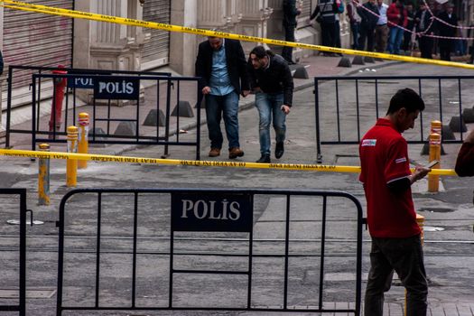 TURKEY, Istanbul: Police secure the area following a suicide bombing in a major shopping and tourist district at Istiklal street in the central part of the city on March 19, 2016 in Istanbul, Turkey. The explosion killed at least five people and left many injured.