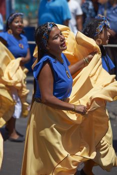 Group of dancers of Africa descent (Afrodescendiente) performing at the annual Carnaval Andino con la Fuerza del Sol in Arica, Chile.