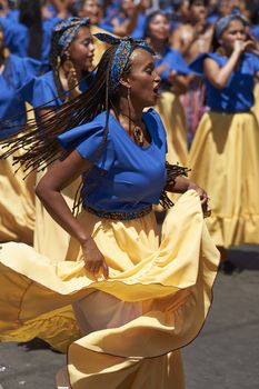 Group of dancers of Africa descent (Afrodescendiente) performing at the annual Carnaval Andino con la Fuerza del Sol in Arica, Chile.