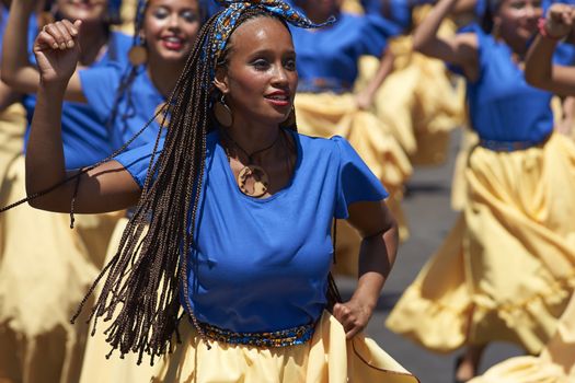 Group of dancers of Africa descent (Afrodescendiente) performing at the annual Carnaval Andino con la Fuerza del Sol in Arica, Chile.
