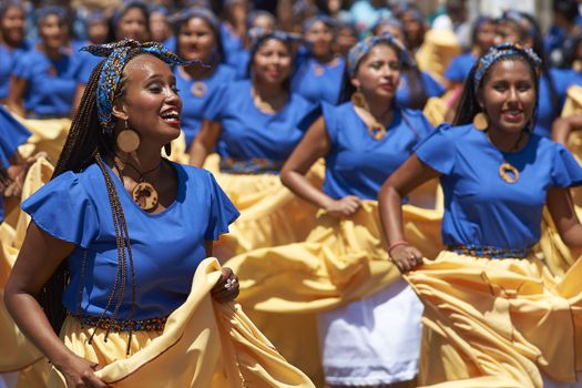 Group of dancers of Africa descent (Afrodescendiente) performing at the annual Carnaval Andino con la Fuerza del Sol in Arica, Chile.