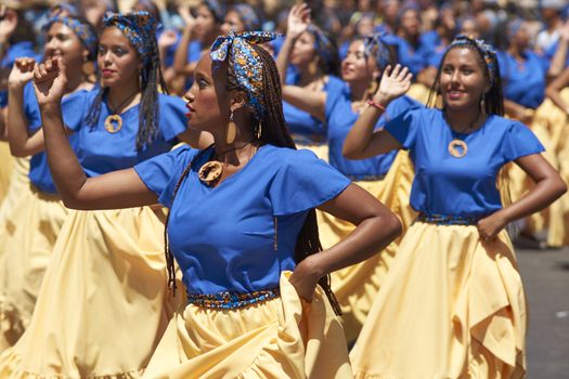 Group of dancers of Africa descent (Afrodescendiente) performing at the annual Carnaval Andino con la Fuerza del Sol in Arica, Chile.