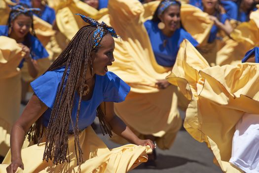 Group of dancers of Africa descent (Afrodescendiente) performing at the annual Carnaval Andino con la Fuerza del Sol in Arica, Chile.