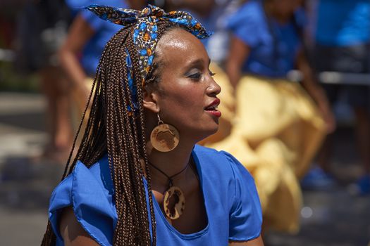 Group of dancers of Africa descent (Afrodescendiente) performing at the annual Carnaval Andino con la Fuerza del Sol in Arica, Chile.