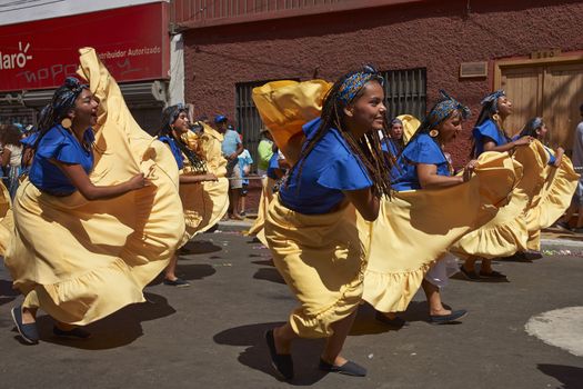 Group of dancers of Africa descent (Afrodescendiente) performing at the annual Carnaval Andino con la Fuerza del Sol in Arica, Chile.