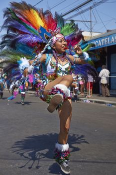 Tobas dancer in traditional Andean costume performing at the annual Carnaval Andino con la Fuerza del Sol in Arica, Chile.