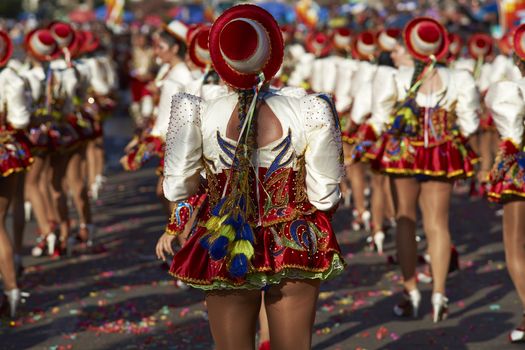 Caporales dancers in ornate costumes performing at the annual Carnaval Andino con la Fuerza del Sol in Arica, Chile.