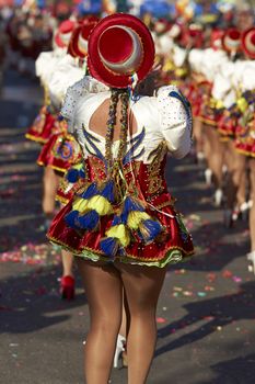 Caporales dancers in ornate costumes performing at the annual Carnaval Andino con la Fuerza del Sol in Arica, Chile.