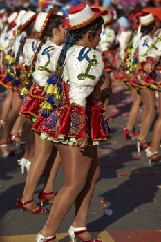 Caporales dancers in ornate costumes performing at the annual Carnaval Andino con la Fuerza del Sol in Arica, Chile.