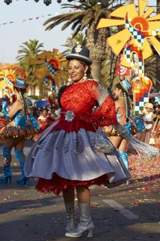 Morenada dancers in traditional Andean costume performing at the annual Carnaval Andino con la Fuerza del Sol in Arica, Chile.