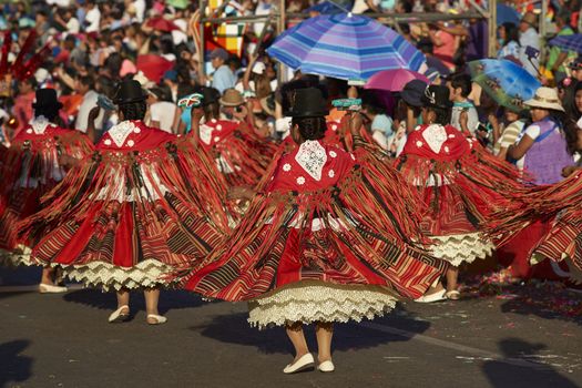 Morenada dancers in traditional Andean costume performing at the annual Carnaval Andino con la Fuerza del Sol in Arica, Chile.