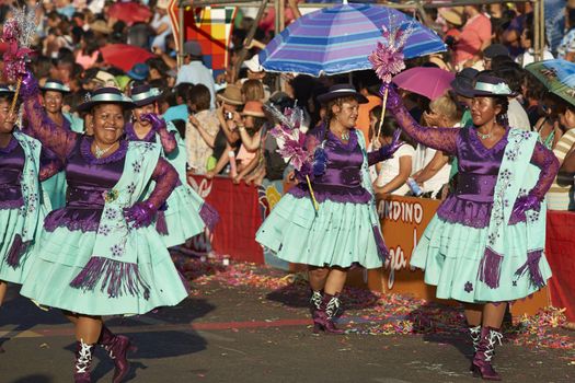Morenada dancers in traditional Andean costume performing at the annual Carnaval Andino con la Fuerza del Sol in Arica, Chile.