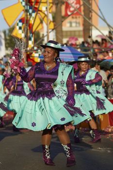 Morenada dancers in traditional Andean costume performing at the annual Carnaval Andino con la Fuerza del Sol in Arica, Chile.