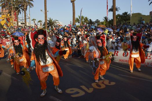 Morenada dance group in traditional Andean costume performing at the annual Carnaval Andino con la Fuerza del Sol in Arica, Chile.