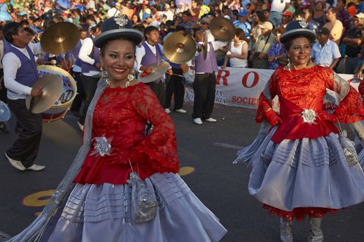 Morenada dancers in traditional Andean costume performing at the annual Carnaval Andino con la Fuerza del Sol in Arica, Chile.