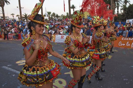 Morenada dancers in traditional Andean costume performing at the annual Carnaval Andino con la Fuerza del Sol in Arica, Chile.