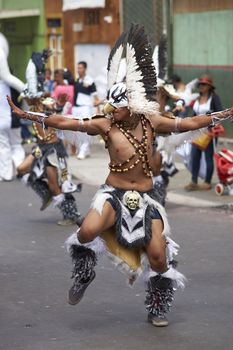 Tobas dancer in traditional Andean costume performing at the annual Carnaval Andino con la Fuerza del Sol in Arica, Chile.