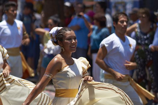 Group of dancers of Africa descent Afrodescendiente performing at the annual Carnaval Andino con la Fuerza del Sol in Arica, Chile.