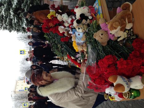 RUSSIA, Rostov-on-Don : A woman lays flowers at the airport entrance in Rostov-on-Don on March 19, 2016.A flydubai passenger jet crashed in southern Russia early Saturday, killing all 62 people on board as it tried to land in bad weather in the city of Rostov-on-Don, officials said. The Boeing 737, heading from Dubai to the southern Russian city, was reportedly making its second attempt to land at 0050 GMT when it missed the runway, erupting in a huge fireball as it crashed, leaving debris scattered across a wide area.