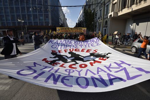GREECE, Athens: Migrants march in central Athens holding a banner that reads Refugees welcome. Neo nazis to jail.Hundreds of migrants and supporters took part in a protest march in central Athens, condemning border fences and the NATO involvement in the refugee crisis on March 19, 2016.The protesters are calling for open borders to help the influx of migrants who are struggling in camps.