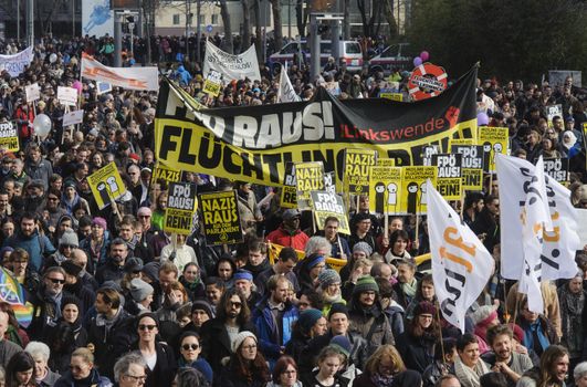 AUSTRIA, Vienna: Thousands march holding banners and waving flags on March 19, 2016 in Austria.The demonstrators have denounced 'fortress Europe' and demanded an end to racism. The demonstrators marched through Vienna, holding signs and waving flags.