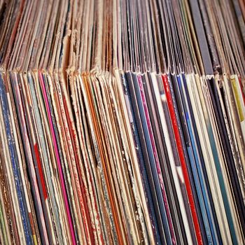 Stack of old vinyl records in paper envelopes