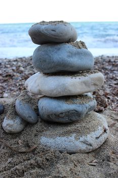 Stones Pyramid on The Beach Symbolizing Zen and Harmony