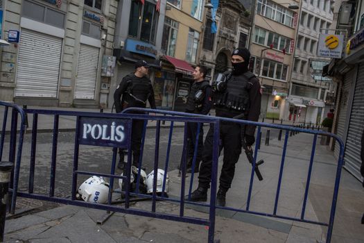 TURKEY, Istanbul: Police secure the area following a suicide bombing in a major shopping and tourist district at Istiklal street in the central part of the city on March 19, 2016 in Istanbul, Turkey. The explosion killed at least five people and left many injured.