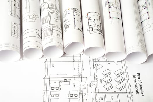 Architecture plan and rolls of blueprints, top view. Building concept