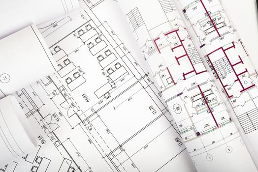 Rolls of blueprints, top view. Building concept