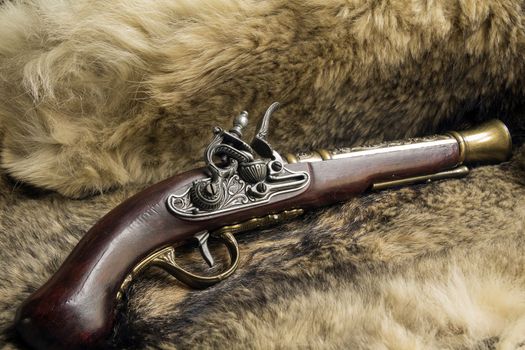 antique decorative gun on natural skin a wild Wolf