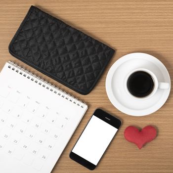 office desk : coffee with phone,wallet,calendar,heart on wood background