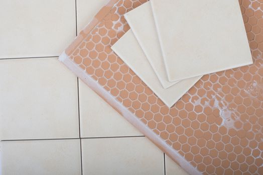 Set of tiles and tile wall isolated on floor, closeup