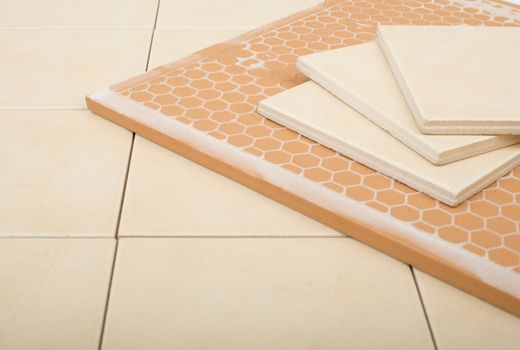 Set of tiles and tile wall isolated on floor, closeup