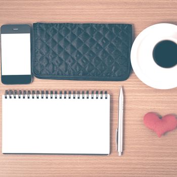 desktop : coffee with phone,notepad,wallet,heart on wood background vintage style