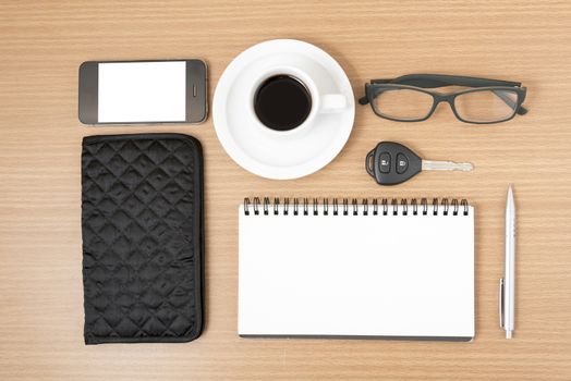 coffee and phone with notepad,car key,eyeglasses and wallet on wood table background