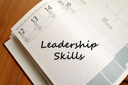 Leadership skills text concept write on notebook