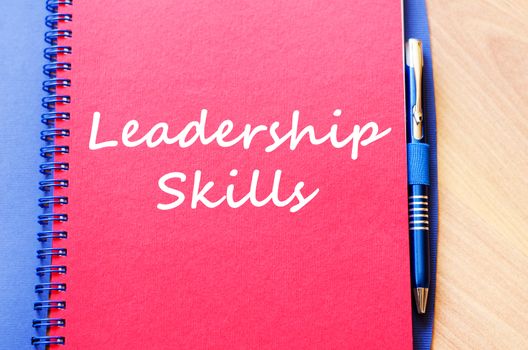 Leadership skills text concept write on notebook with pen