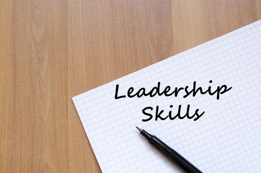Leadership skills text concept write on notebook with pen