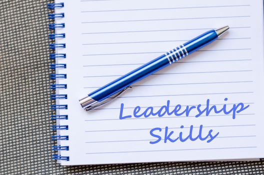 Leadership skills text concept write on notebook with pen
