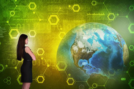 Business woman in front of holographic screen with earth globe and numbers. Elements of this image furnished by NASA