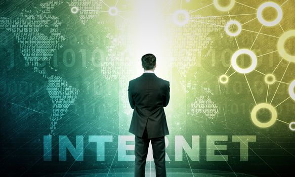 Businessman in front of holographic screen with word map and word internet, intenet concept