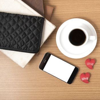 office desk : coffee with phone,stack of book,wallet on wood background