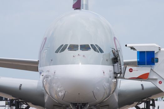 Singapore - February 17, 2016: Front of an Airbus A380 in the livery of Qatar Airways during Singapore Airshow at Changi Exhibition Centre in Singapore.