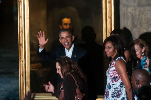 CUBA, Havana: US President Barack Obama (c) waving next to his wife and Fist lady Michelle Obama (R) at the Museum of the City during a visit to the Old Havana on March 20, 2016. Barack Obama on Sunday became the first US president in 88 years to visit Cuba, touching down in Havana for a landmark trip aimed at ending decades of Cold War animosity.
