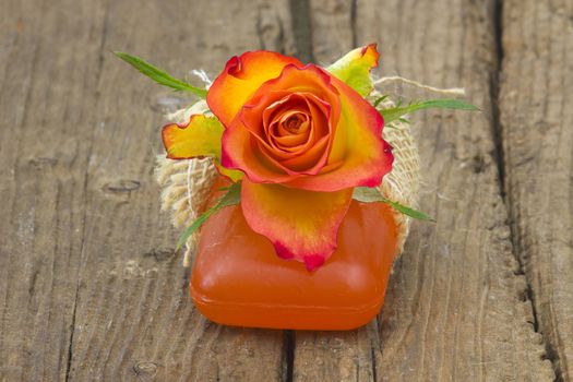 bar of natural soap and rose