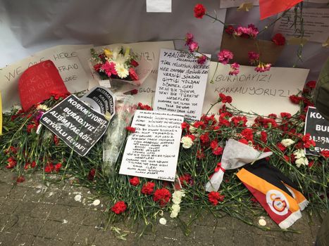 TURKEY, Istanbul: A picture is taken of cards and flowers left at the site of a blast on Istiklal Street, a major shopping and tourist district, in central Istanbul on March 20, 2016 in tribute to four people killed during a suicide blast that ripped through Istanbul less than a week after another deadly attack left 35 dead in Ankara.